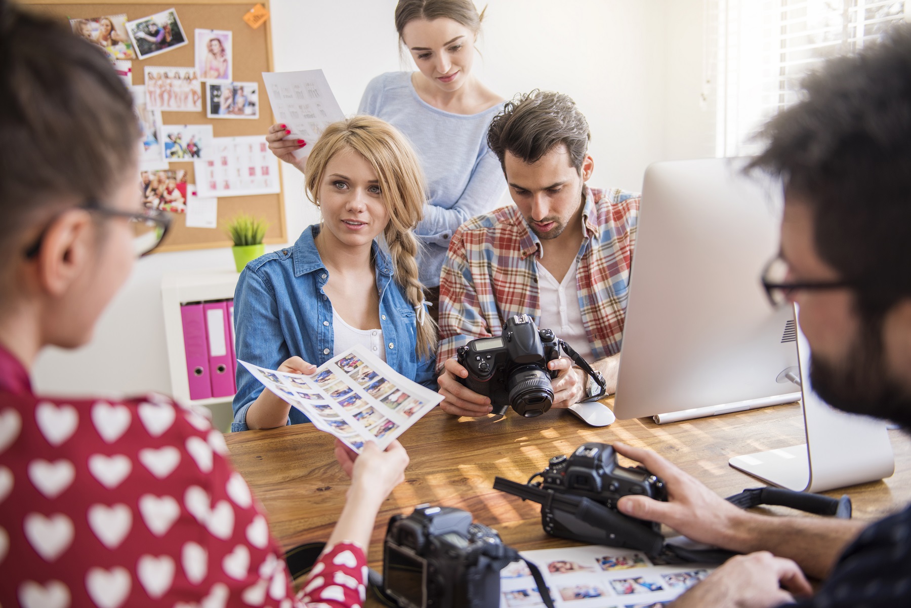 Professional photographers working in their office